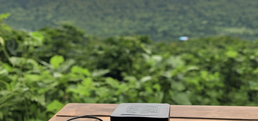 AI-powered environmental sensor in a rural outdoor location displaying real-time data on a local screen.